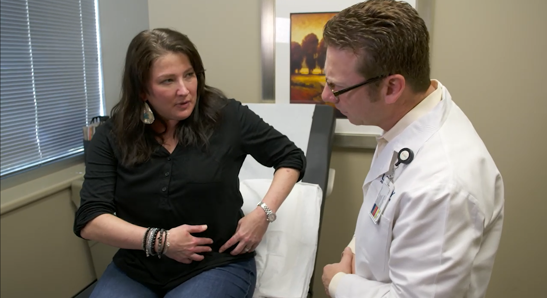 Patient explaining her problem to a doctor